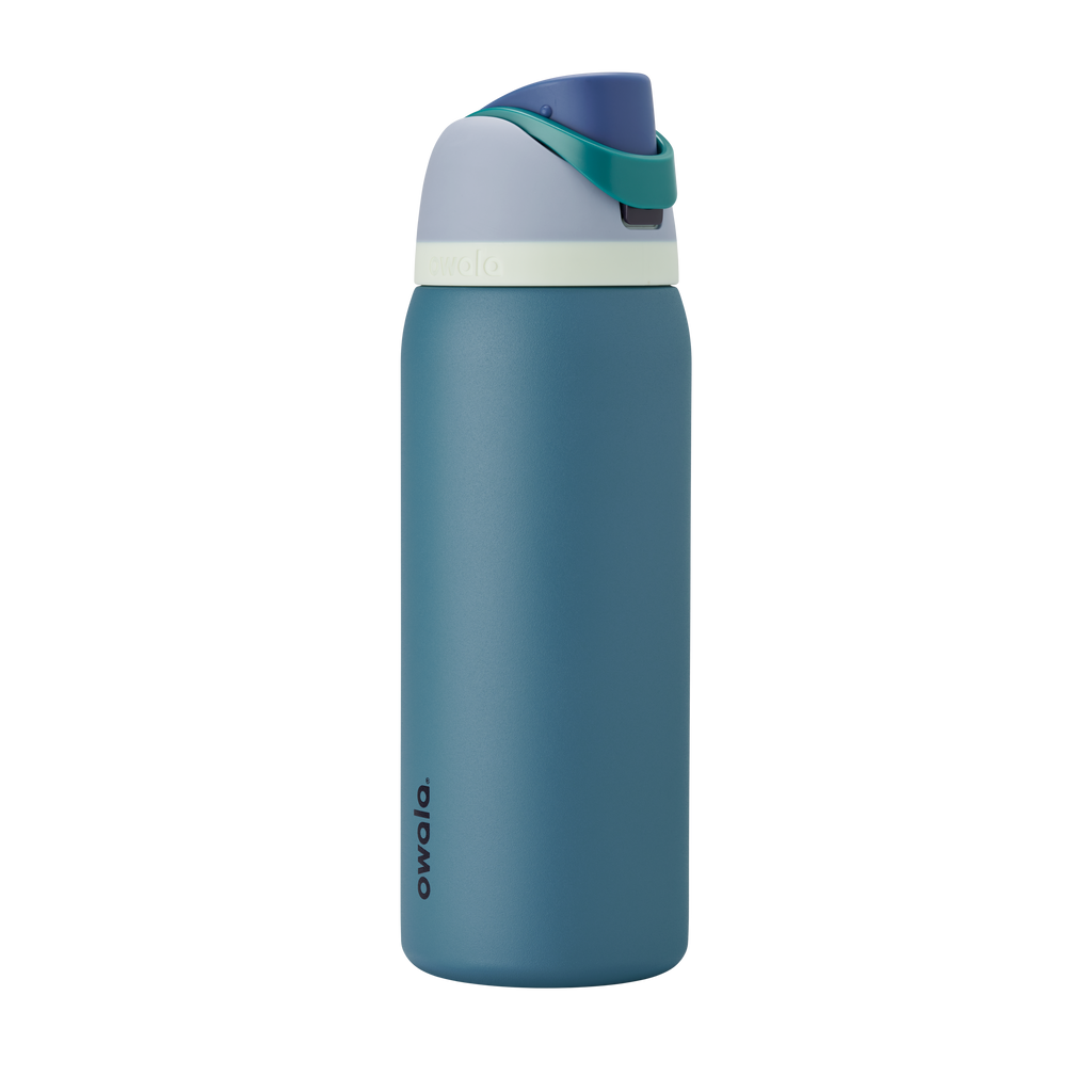 FreeSip 32oz in Denim, muted teal blue insulated bottle with dusty navy flip cap and pale cream accent band
