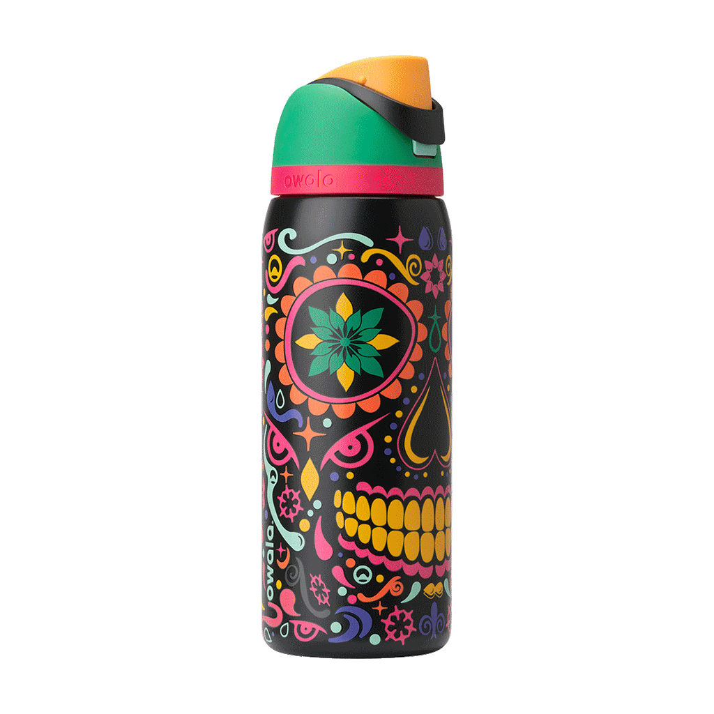 Rotating view of FreeSip in Sugar Skull, black body with colorful Day of the Dead sugar skull graphic in pink, yellow, green, and orange; green flip cap with orange detail and hot pink accent band on the lid; glows in the dark